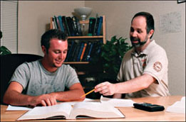 Photo of David with a student